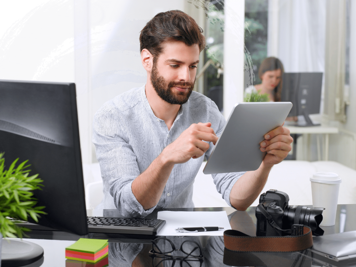 a man at work looking at a table, symbolizing ADHD and anxiety