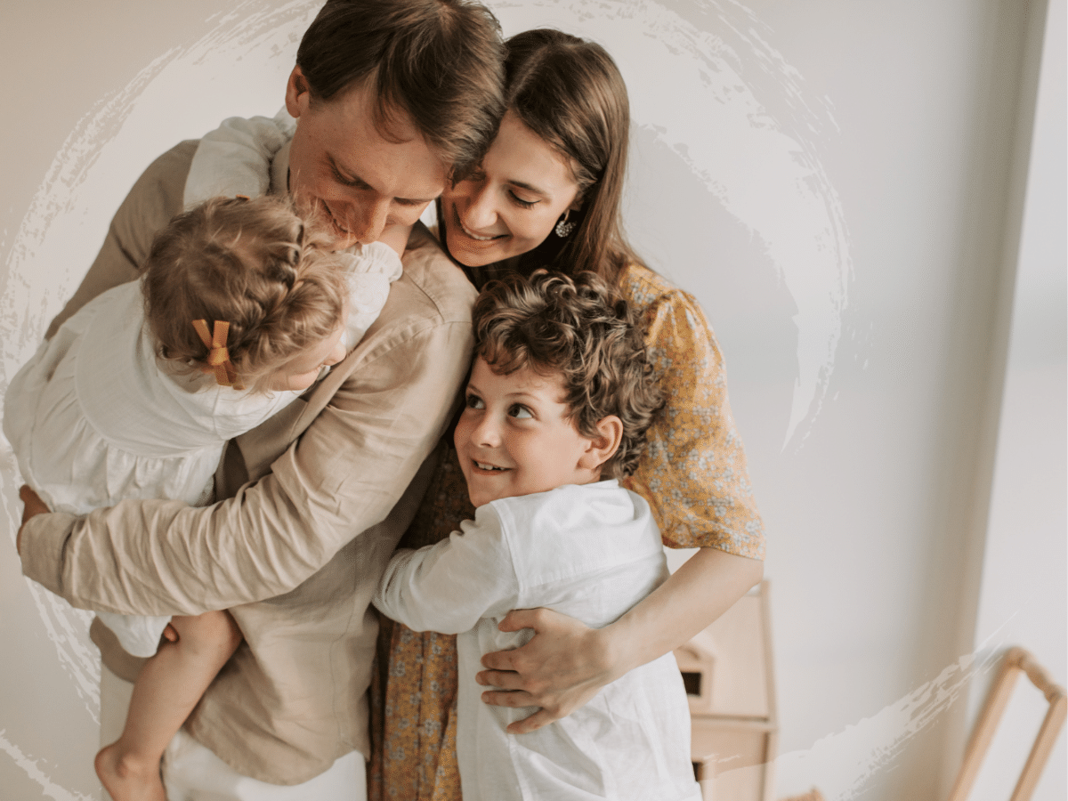 A family of four embracing, symbolizing bipolar disorder psychiatry