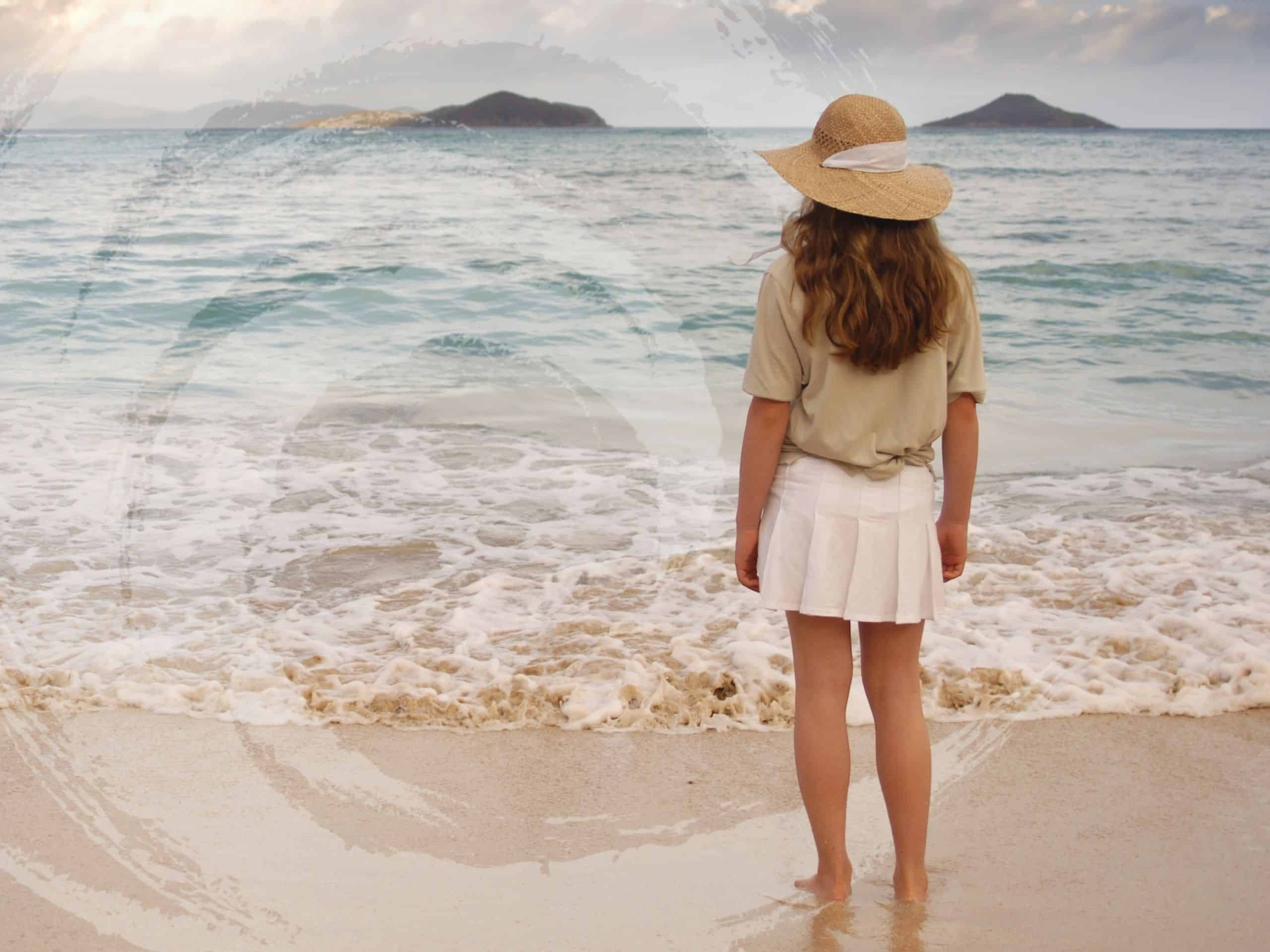 A woman standing on the ocean shore, symbolizing the questions: What does Spravato feel like