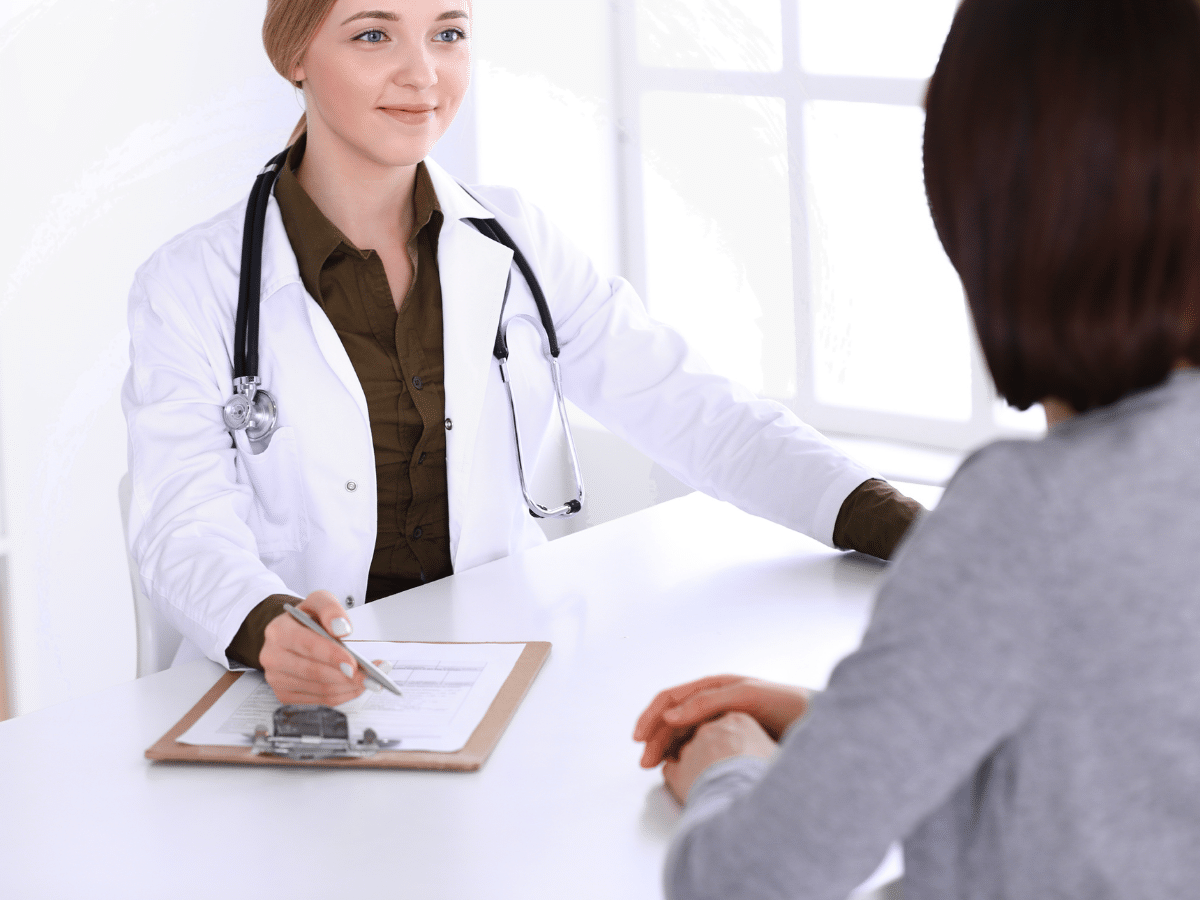 A doctor consulting a patient, symbolizing TMS vs ECT