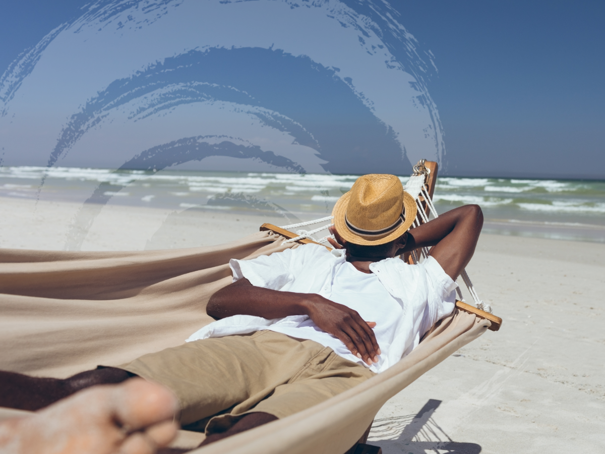 A man sleeps in a hammock at the beach, symbolizing the importance of sleep and mental health